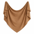 Organic warm brown swaddle blanket by Sprout & Fawn with soft, cozy fabric and heirloom-inspired design for baby comfort.