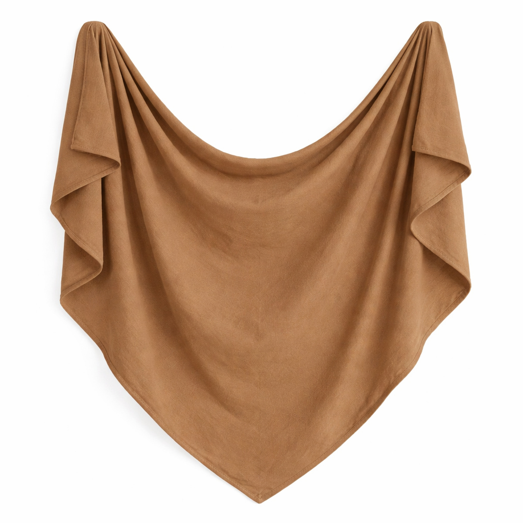 Organic warm brown swaddle blanket by Sprout & Fawn with soft, cozy fabric and heirloom-inspired design for baby comfort.