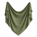 Heirloom organic swaddle in olive green by Sprout & Fawn, featuring soft fabric and a cozy, versatile design.