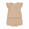 Sprout & Fawn sandstone waffle lounge set featuring a relaxed fit with a matching top and pants in soft, textured fabric.