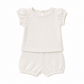Ivory waffle lounge set by Sprout & Fawn, featuring a cozy, textured top and matching relaxed pants for comfortable home wear.