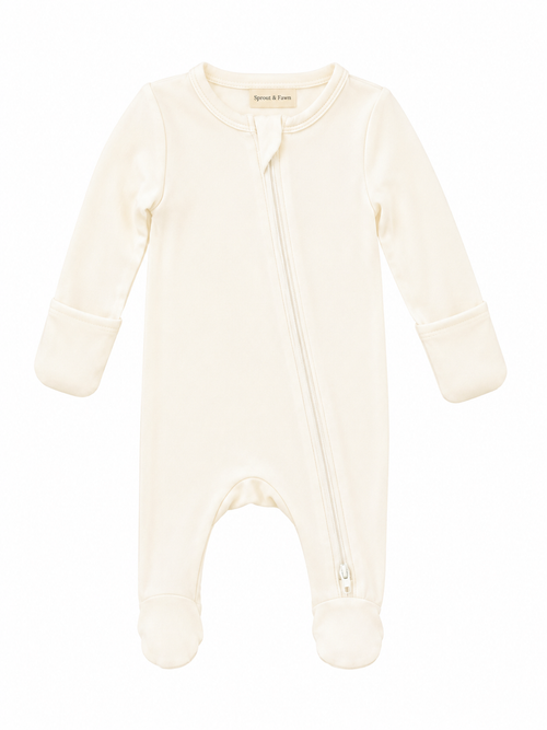 Sprout & Fawn Bamboo Zip Footie in vanilla cream, showing soft, cozy fabric with front zipper and long sleeves for babies.